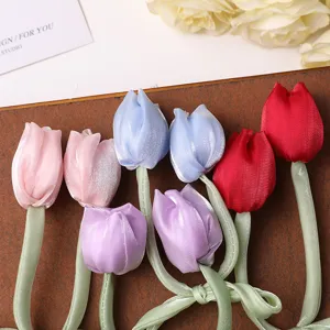 Fabric tulip flower detail shot, colorful ribbon handmade DIY hair accessory material.