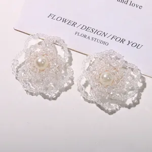 Handmade beaded flower hair clip or earrings accessory with faux pearl center for elegant styling.