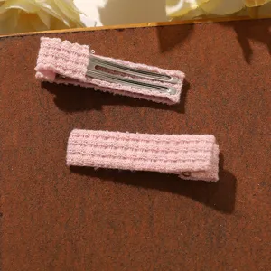 Pink knitted hair clip detail view, soft wool fabric side clip set for sweet girls daily wear.