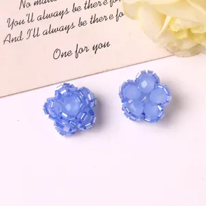 Detailed shot of handmade beaded flower accessories for DIY hair clips and cute jewelry making.