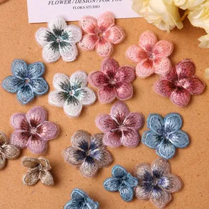Embroidered five-petal flower patch gradient DIY clothing accessory craft fine detail view.
