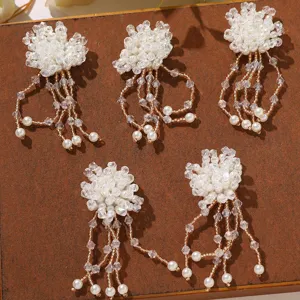 Detailed close-up view of handmade french pearl crystal beaded flower tassel DIY accessories.