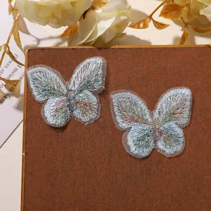 Vista detallada de parches de mariposa bordados de encaje de doble capa, accesorios de hilo mágico DIY.