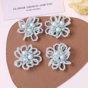Close-up detail view of light blue beaded pearl hollow flower DIY craft accessories.