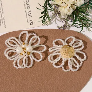 White beaded flower DIY accessories, pearl floral patches for earrings and hair clips.