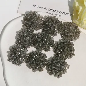 Close-up of sparkling crystal seed bead flower clusters, perfect for DIY apparel and shoes.