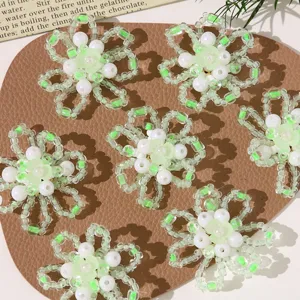 Handmade beaded flower DIY craft accessories, cute green and white floral charms for jewelry.