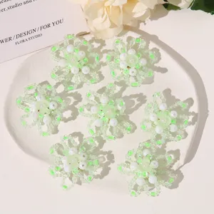 Handmade beaded flower accessories, green and white crystal bead clusters for DIY jewelry crafting.