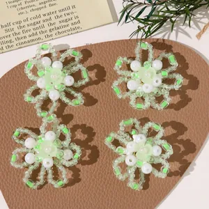 Handmade beaded flower DIY accessories detail, light green and white crystal bead clusters.