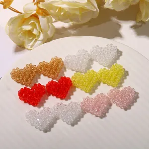Close-up of colorful 3D woven beaded heart DIY accessories, perfect for jewelry and crafts.