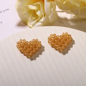 Amber crystal beaded heart DIY charm detail view showing exquisite handmade woven texture.