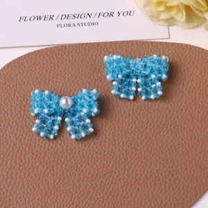 Handmade blue beaded pearl bow DIY accessories for earrings, hair pins and shoe charms.