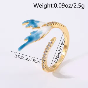 Gold stainless steel open ring with blue enamel antler and sparkling cubic zirconia stones.