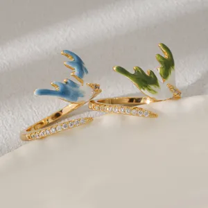 Elegant stainless steel open rings featuring colorful enamel antlers and sparkling cubic zirconia.