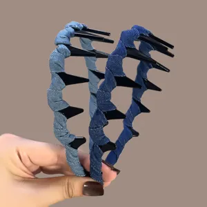 Denim wrapped tooth hair hoop detail showing blue fabric and comb design features clearly.
