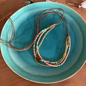 Boho multi-strand beaded necklace waist chain with natural stone pendant and leather cord.