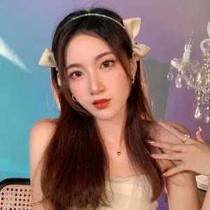 Elegant bow headband with rhinestones for women, stylish sweet hair accessory for daily wear.