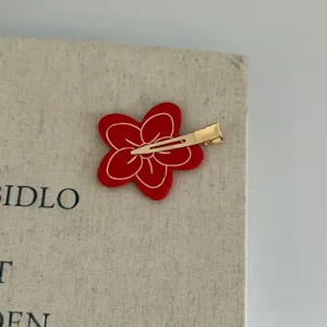 Red flower hair clip with gold metal duckbill design, perfect for daily cute hair styling.