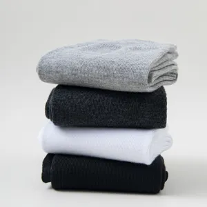 Men's mid-tube ribbed casual socks detail view showing classic black, white and gray.