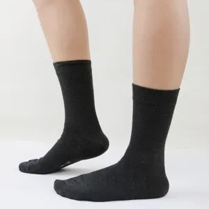 Men's solid black mid-calf socks detail shot showing breathable fabric and comfort.