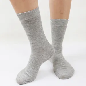 Men's gray crew socks detail view, breathable casual business socks with loose top design.