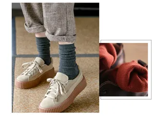 Close-up detail shot of cozy ribbed cotton mid-tube socks paired with stylish casual sneakers.