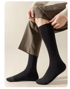 Men's thick black thermal long socks for autumn and winter, cozy fleece lined crew socks.