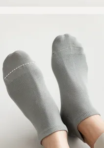 Detail view of gray mesh low cut men socks showing breathable fabric and comfortable fit.