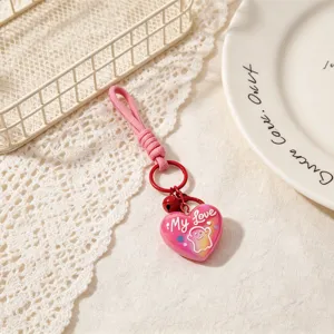 Cute pink heart keychain bag charm with braided rope and bell love design for women gifts.