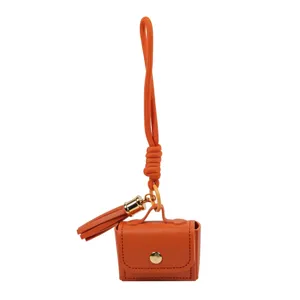 Oranger PU Leder Mini Taschenanhänger Schlüsselbund mit Quaste und Riemen für Damen chic.