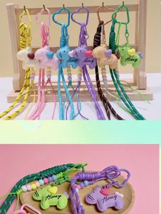 Cute resin cartoon pony keychain and bag charm with colorful braided rope and heart.