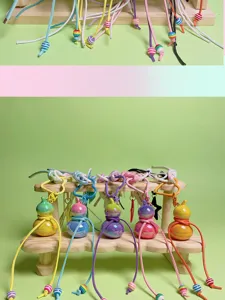 Handcrafted colorful gourd keychain with woven lanyard and cute beads, perfect bag pendant charm.