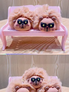 Cute capybara plush keychain bag charm featuring fluffy pompom and stylish sunglasses accessory.