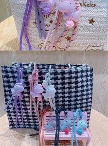 Plush animal bag charm keychain detail view, cute hanging ornament for bags and keys.