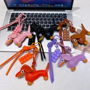 Cute leather dachshund bag charm and keychain with chocolate pendant in multiple vibrant colors.