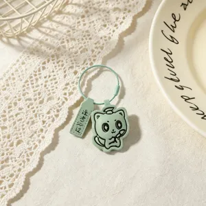 Cute green leather keychain with cat design exam blessing pendant, perfect graduation student gift.
