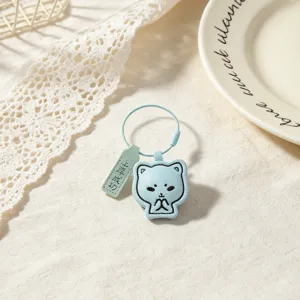 Blue leather cat keychain detail view, cute student graduation gift with success tag.