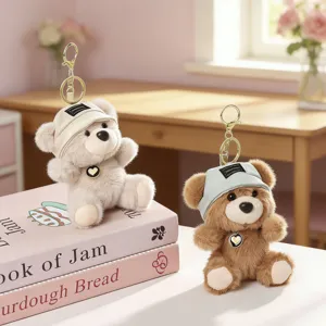 Cute plush bear keychain detail, soft stuffed animal bag charm pendant for daily use and decoration.