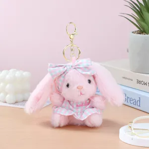 Cute pink plush rabbit keychain with checkered dress and bow, perfect bag pendant gift.
