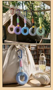 Detailed view of portable silicone grip ring keychain, stress relief hand exerciser bag pendant.