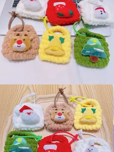Handmade knitted Christmas mini coin purse keychain, cute plush pendant storage detail.