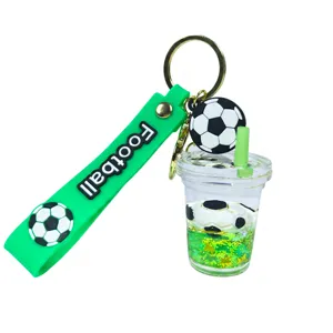 Football theme quicksand cup keychain with green silicone strap and glitter liquid charm.