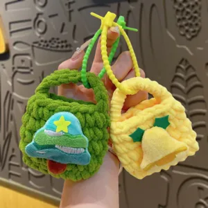 Cute handmade knitted mini coin purse with adorable Christmas tree and bell keychain charms.