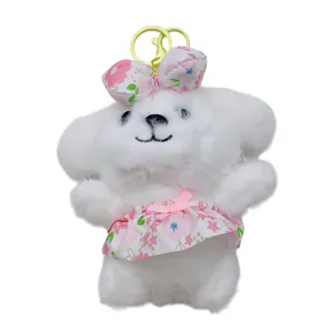 Mignon porte-clés chiot en peluche blanche avec robe et nœud à fleurs roses, jouet doux.