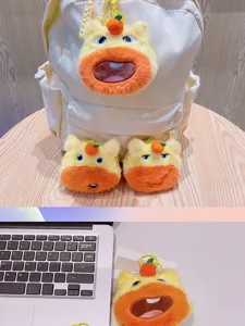Cute capybara plush coin purse keychain with orange detail, soft stuffed animal bag charm accessory.