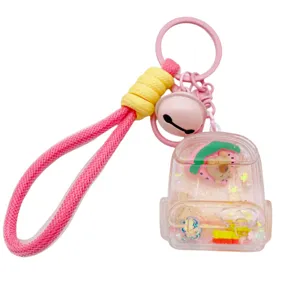 Niedlicher flüssiger Treibsand Kapibara Rucksack Schlüsselanhänger mit rosa Band und Glöckchen.