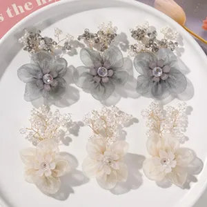 Organza flower DIY hair accessories detail, 3D faux pearl camellia earring material craft.