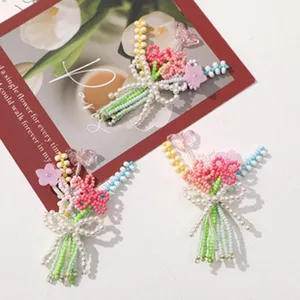 Handmade beaded flower hair clip DIY accessory cute pearl bow design sweet style detail view