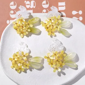 Detailed view of DIY rabbit yellow flower hair clip and jewelry making material accessories.