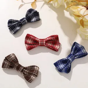 Korean preppy style retro fabric plaid bow hair clip detail view, charming daily hair accessory.